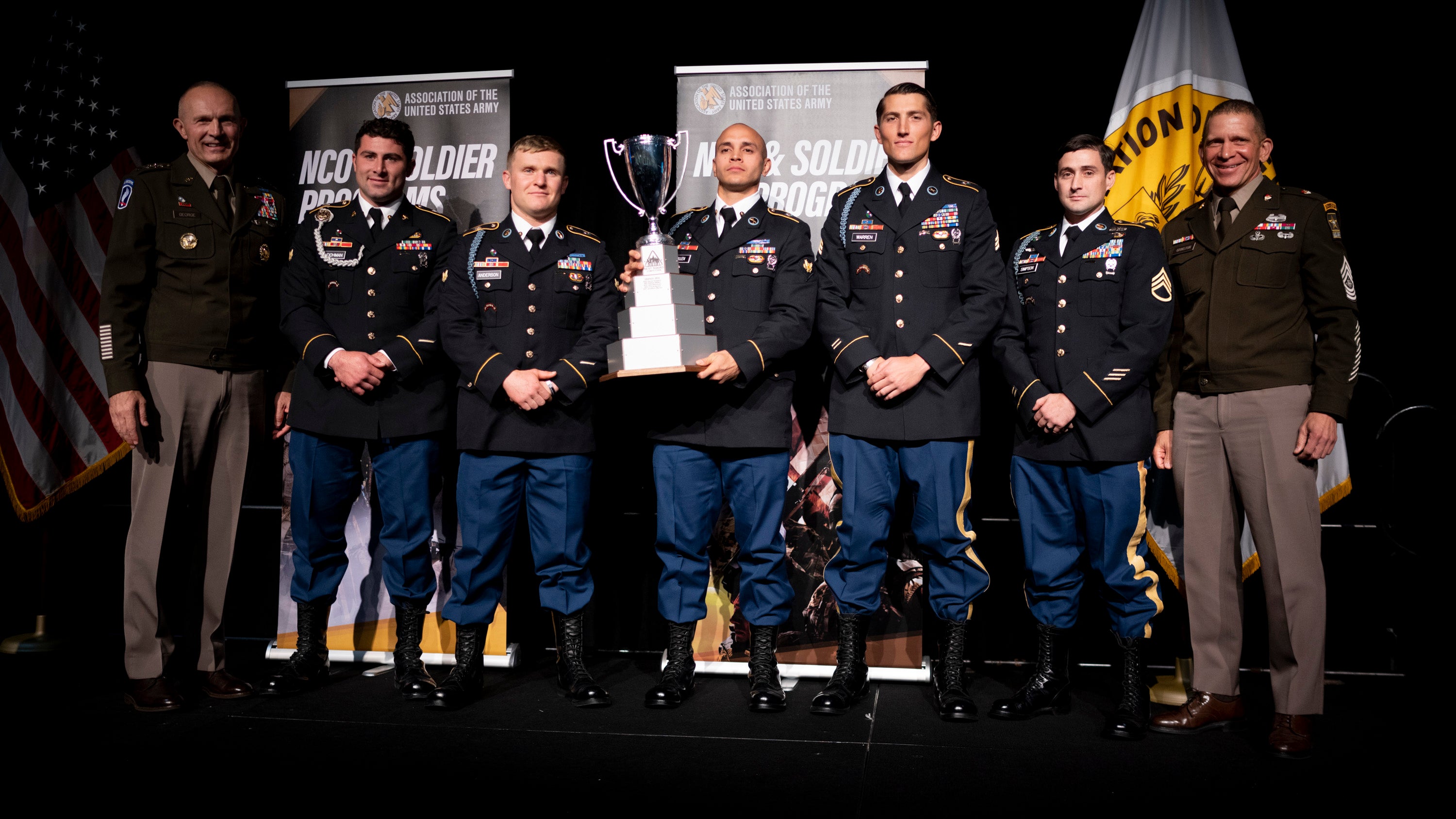 Soldiers representing the U.S. Army Special Operations Command accept the trophy for Best Squad during the Sergeant Major of the Army’s Recognition Luncheon at AUSA 2022 Annual Meeting in Washington, D.C., Monday, Oct. 10, 2022. (Jeromie Stephens for AUSA)
