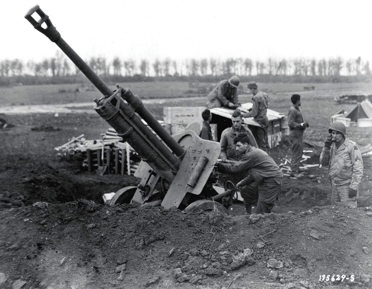 A gun crew with the 90th Infantry Division works with a Russian weapon in France in October 1944. (Credit: U.S. Army)