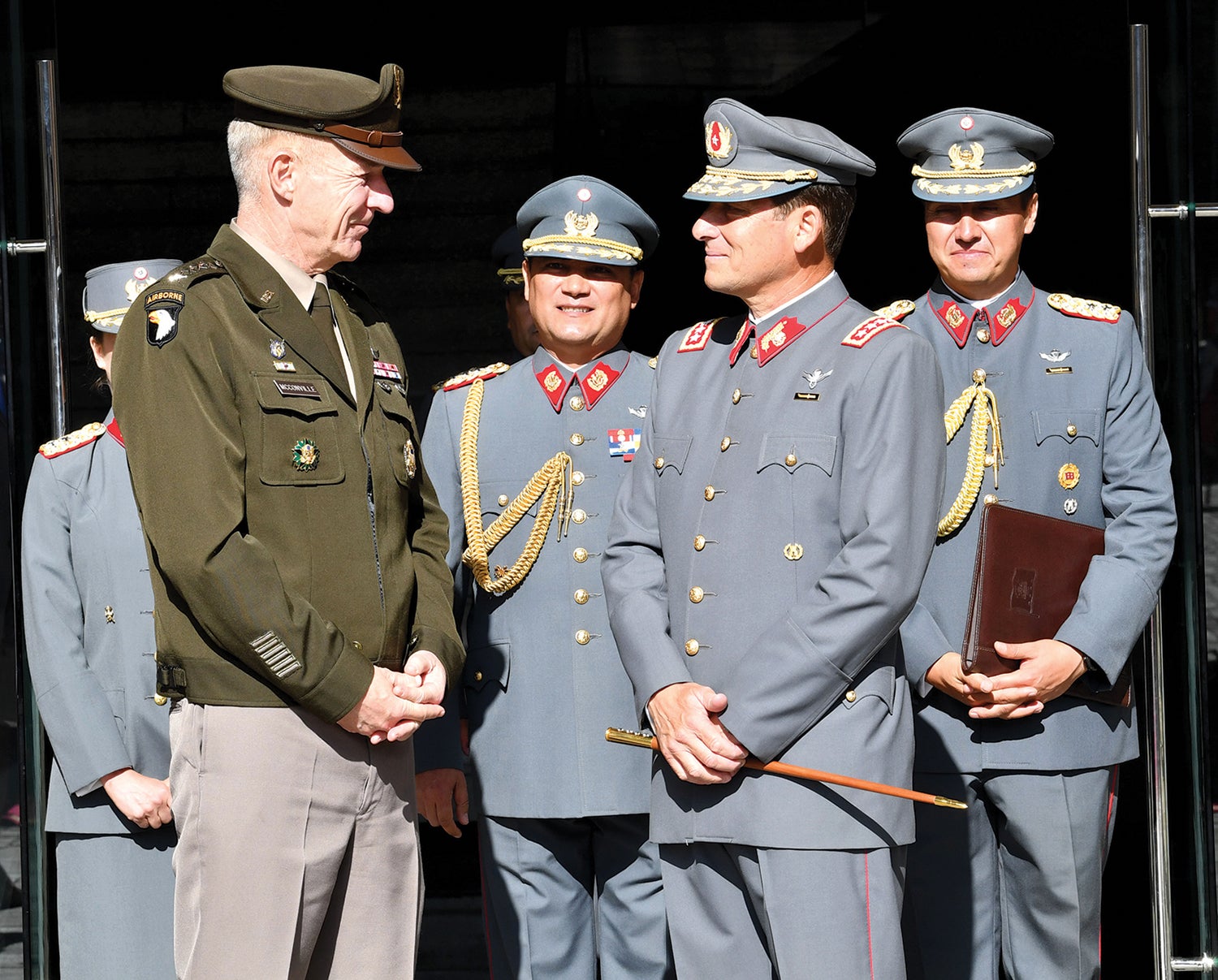 Army Chief of Staff Gen. James McConville, left, meets with members of the Chilean army during a visit to Chile in February. (Credit: U.S. Army/Master Sgt. Joseph Moore)