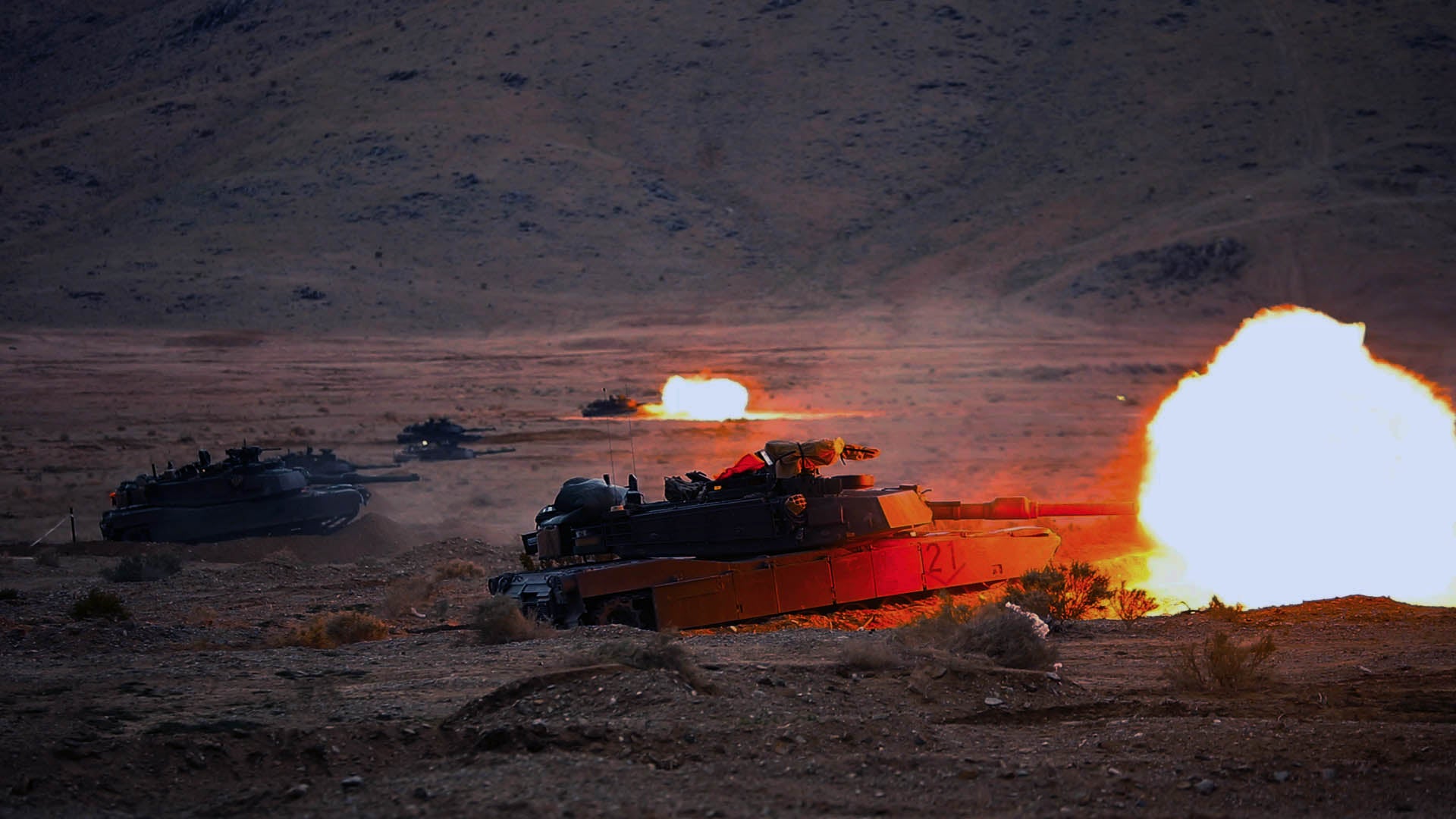 Soldiers with the 2nd Armored Brigade Combat Team, 3rd Infantry Division, fire from a modernized M1A2 SEVv3 Abrams tank during a rotation at the National Training Center, Fort Irwin, California. (Credit: U.S. Army/Sgt. Dre Stout)