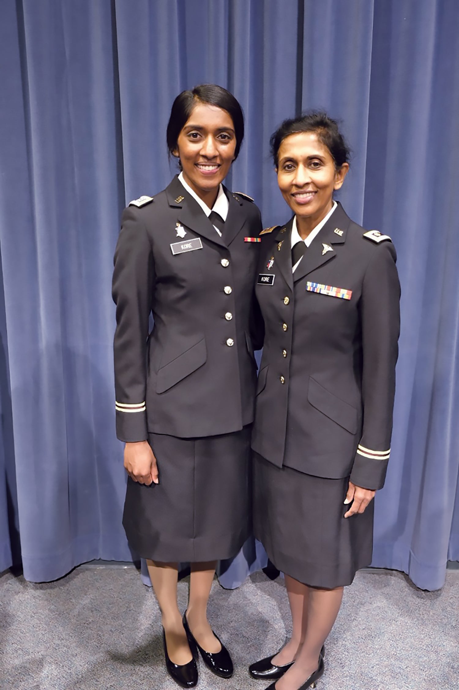 Newly commissioned Capt. Lydia Kore, left, poses for a photo with her mother, then-Maj. Doris Kore, a member of the U.S. Army Reserve, in 2019. (Credit: courtesy photo)