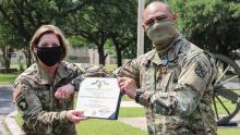 In June 2020, then-Lt. Gen. Laura Richardson, left, as commander of U.S. Army North, recognized Chief Warrant Officer 4 Samitioata Roberts with the Joint Service Achievement Medal for his work supporting DoD’s COVID-19 response. (Credit: U.S. Army)
