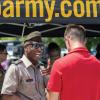 Soldier speaking to potential recruit at event