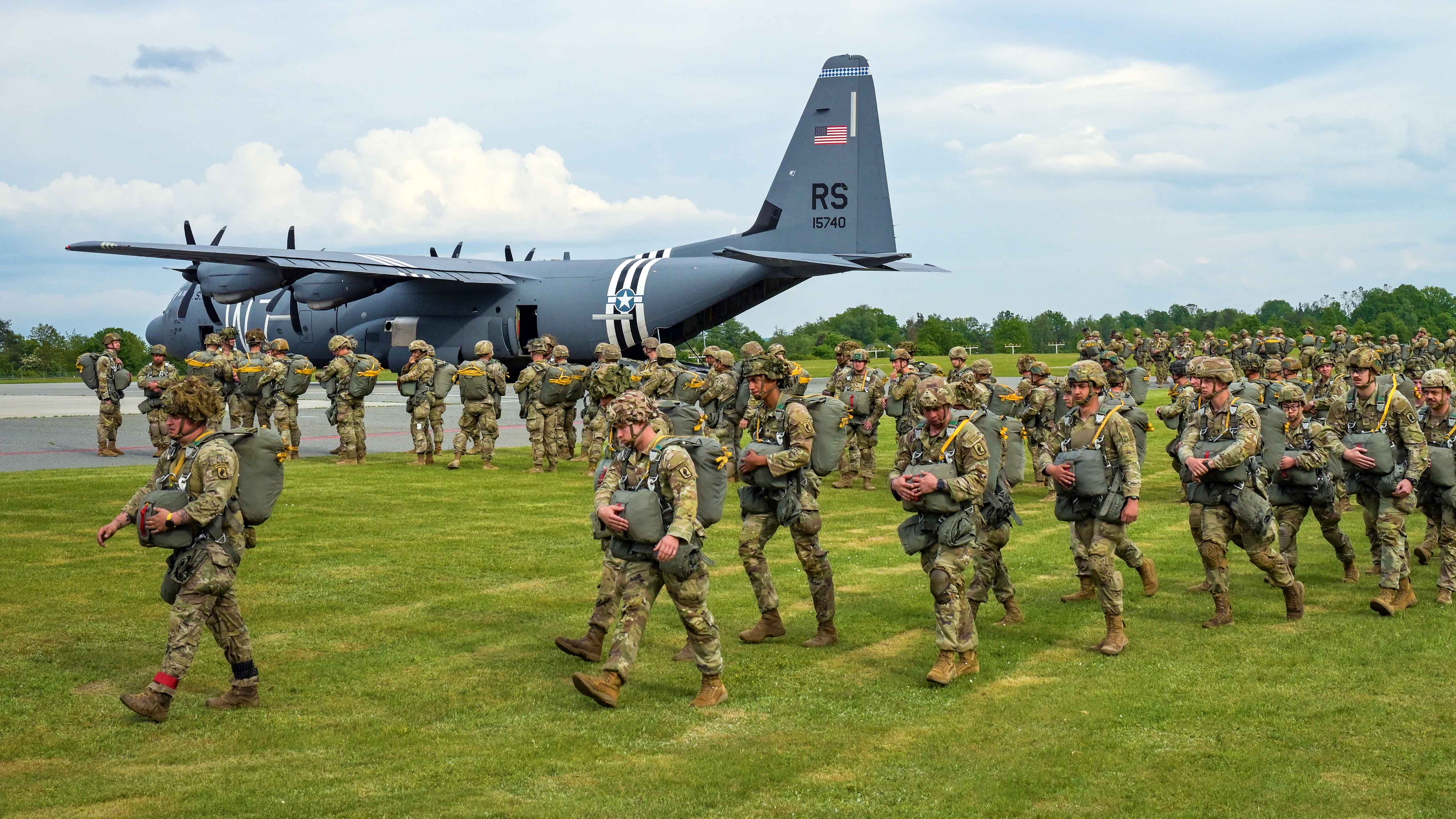 U.S. Army paratroopers with 1st Squadron, 91st Cavalry Regiment, 173rd Airborne Brigade get ready to board a U.S. Air Force C-130 Hercules during an airborne operation at the 7th Army Training Command's Grafenwoehr Training Area, Germany, May 16, 2024.