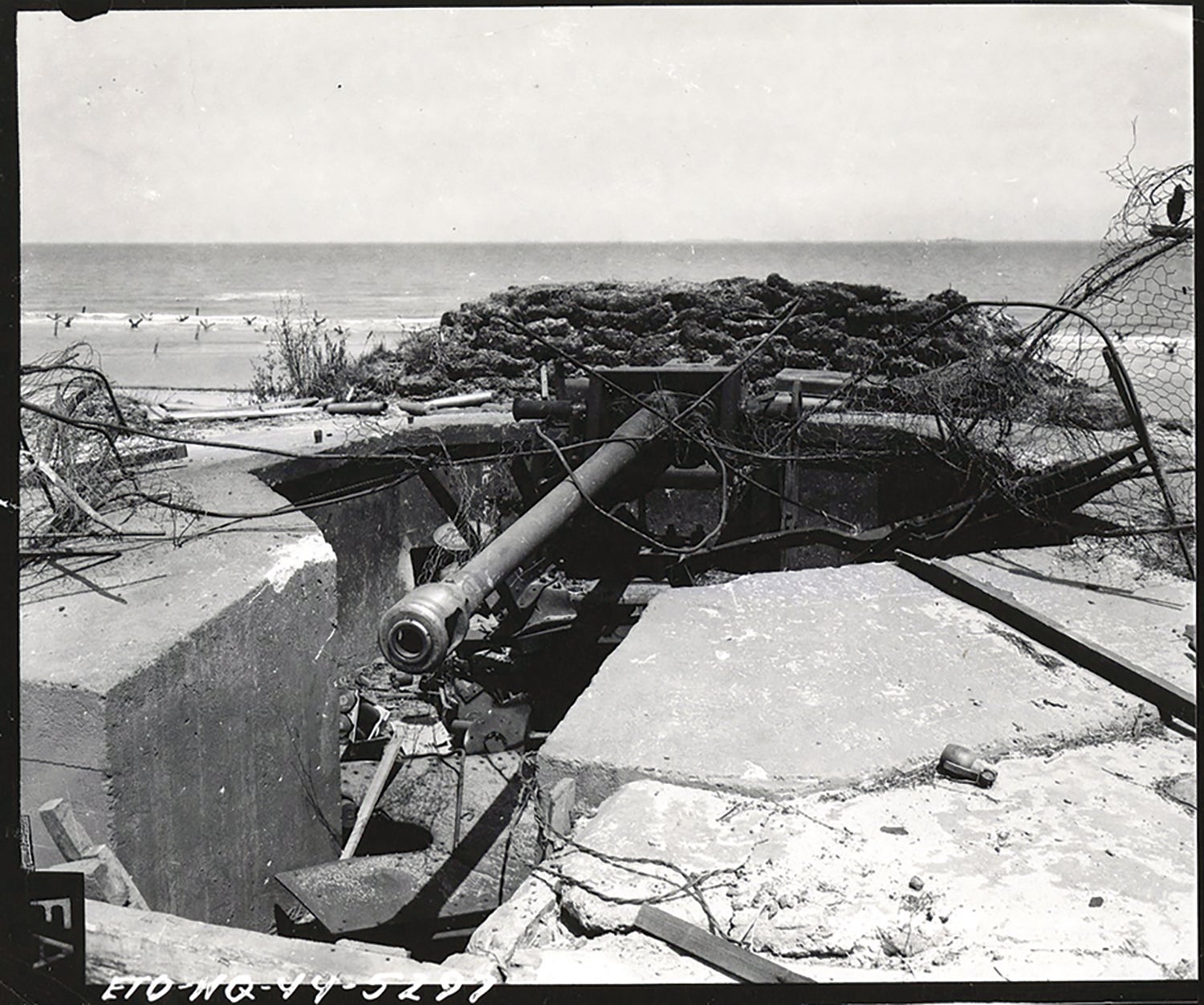 A burned-out German coastal gun emplacement destroyed by U.S. soldiers in France. (Credit: National Archives)