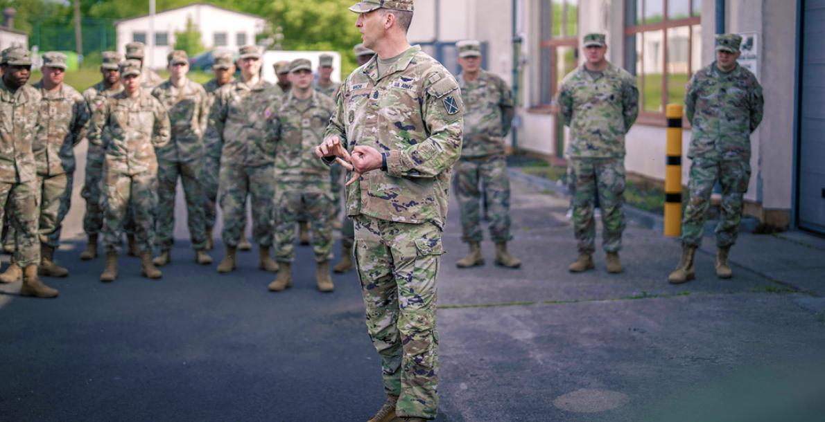 Command Sgt. Maj. Giancarlo Macri, senior enlisted leader for the 10th Army Air and Missile Defense Command, speaks to soldiers in Sembach, Germany, before signing a proclamation addressing sexual harassment and assault response and prevention. (Credit: U.S. Army/Spc. Yesenia Cadavid)