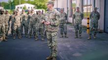 Command Sgt. Maj. Giancarlo Macri, senior enlisted leader for the 10th Army Air and Missile Defense Command, speaks to soldiers in Sembach, Germany, before signing a proclamation addressing sexual harassment and assault response and prevention. (Credit: U.S. Army/Spc. Yesenia Cadavid)