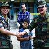 Then-Col. George Alexander, left, greets an Ecuadorian army commander and his son during a medical readiness training exercise in Ecuador in 1996.